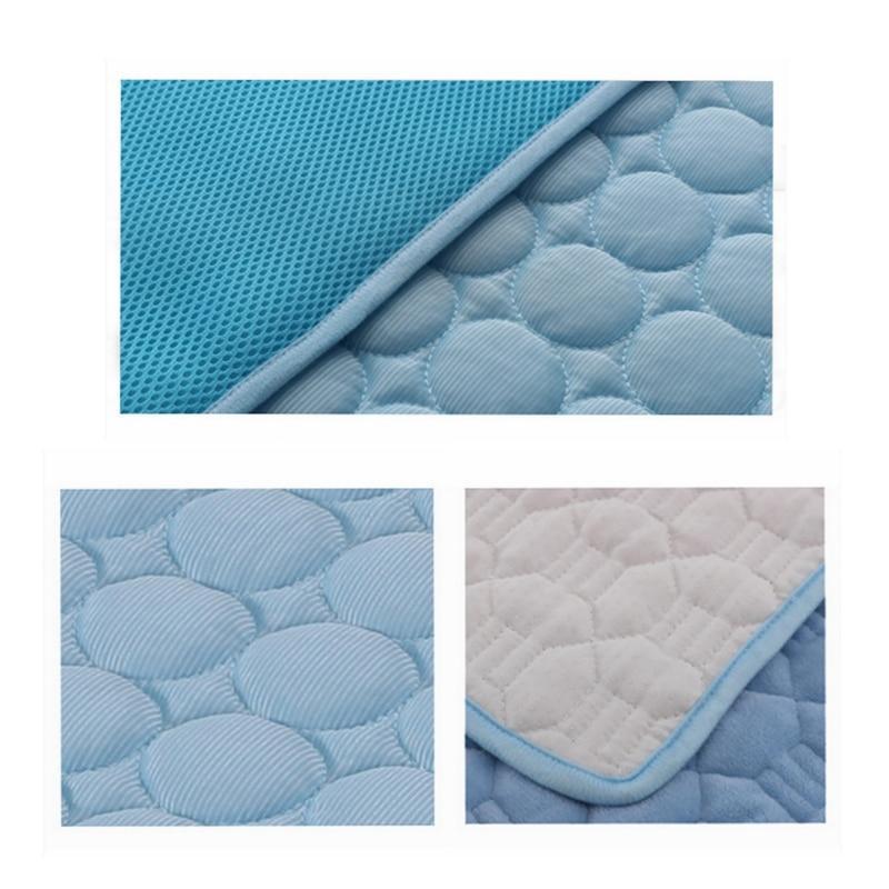 Blue quilted self-cooling pad with textured surface and corner detail on a white background