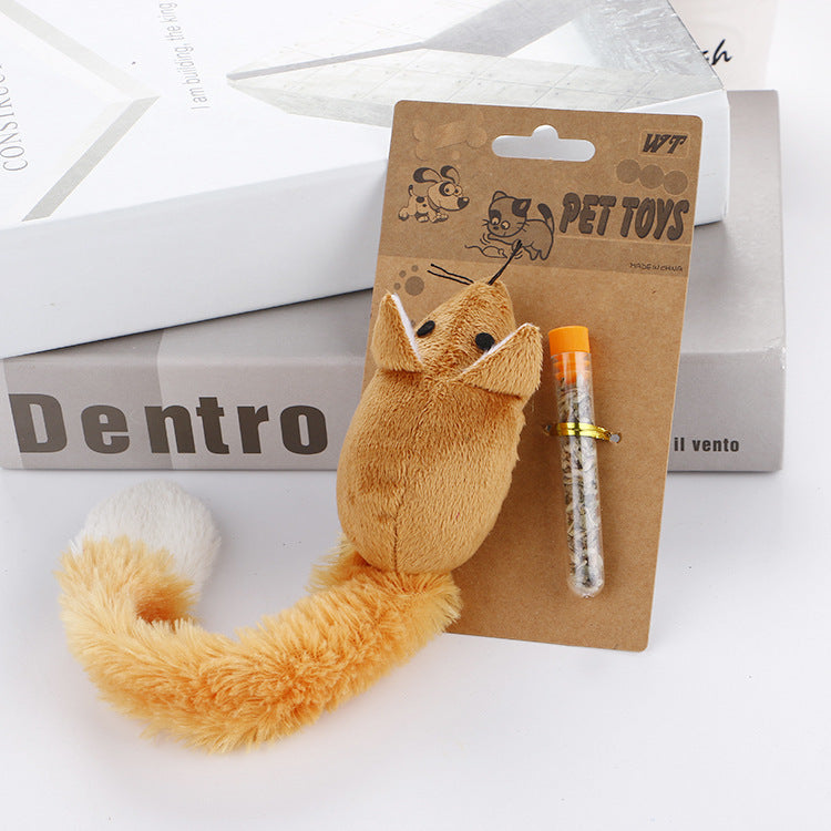 Plush fox toy with a pen on a brown card labeled 'PET TOYS' against a white background.