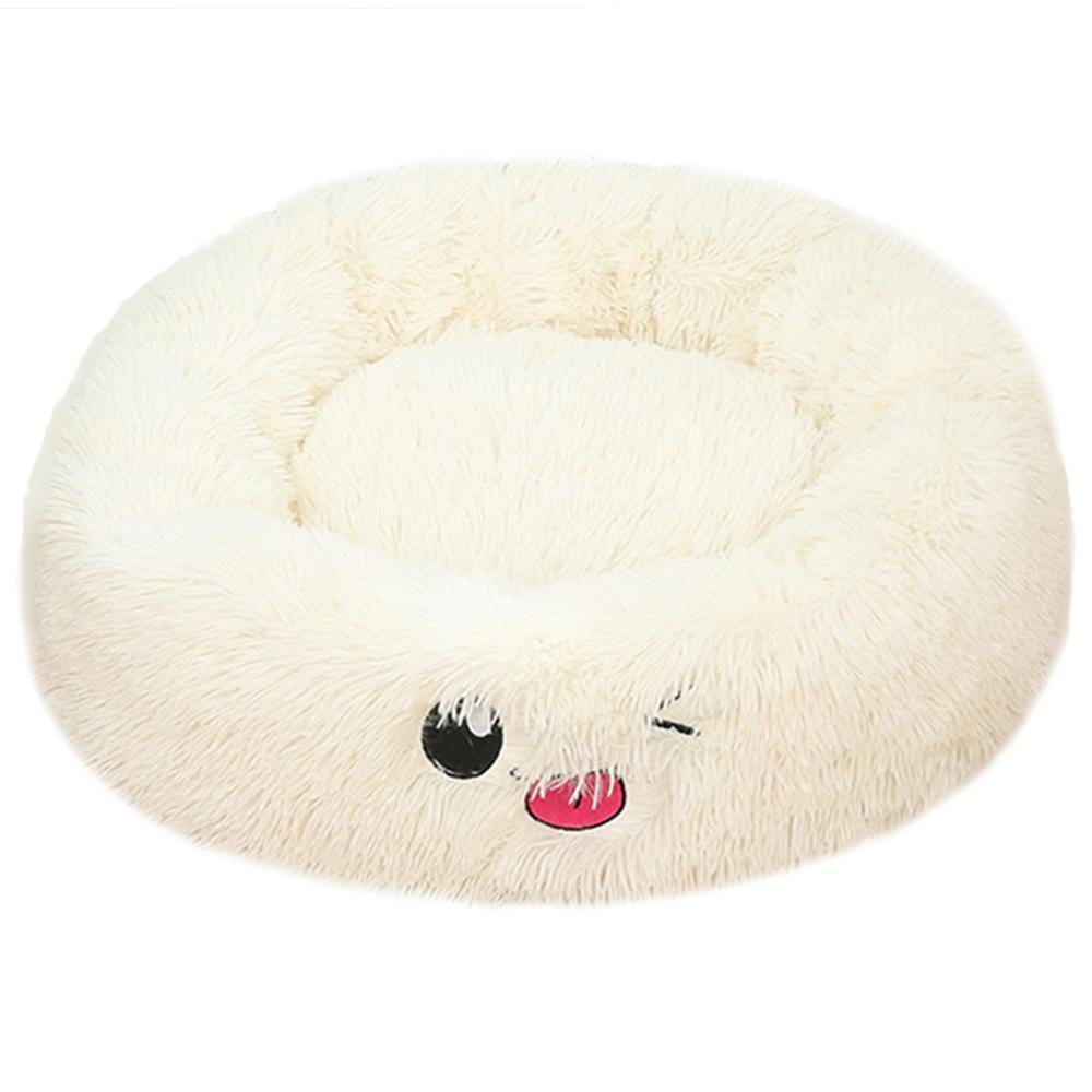 Round plush pet bed with a cute face design on a white background