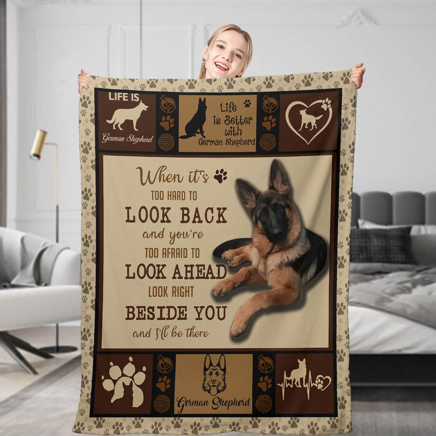 Person holding a German Shepherd-themed blanket with text and graphics.