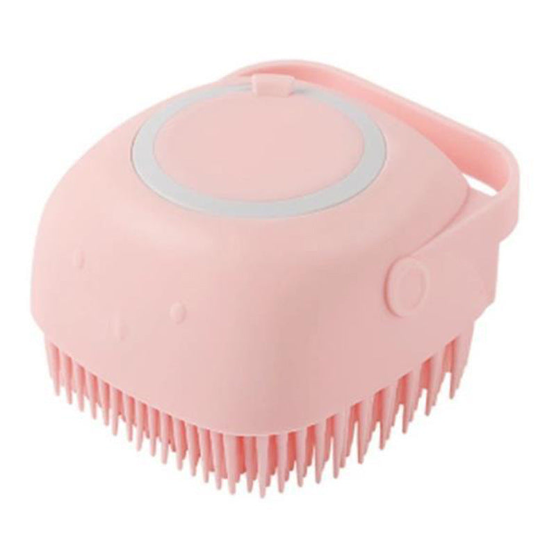 Pink silicone scrubber with bristles on a white background
