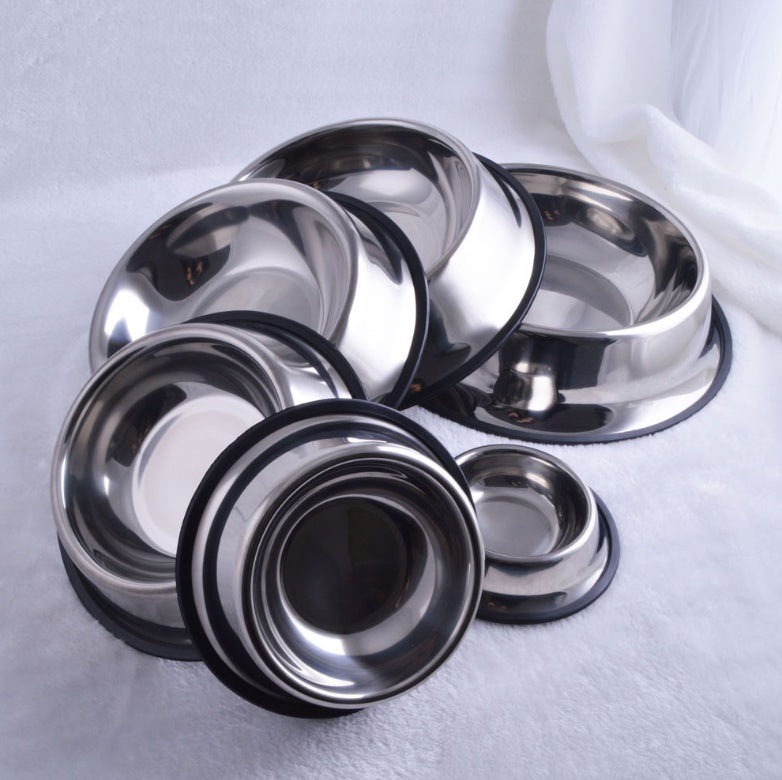 Set of stainless steel bowls on a light gray background