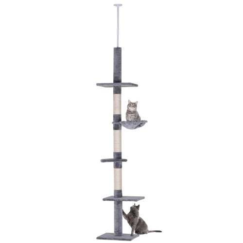 Cat tree with multiple levels and a cat perched on one of the shelves against a white background