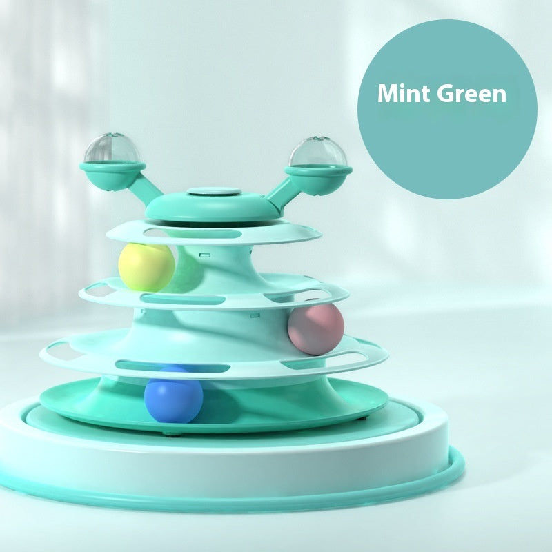 Mint green toy with colorful balls on a light gray background