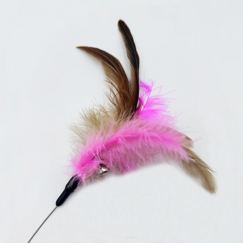 Cat toy with pink feathers and a black handle on a white background