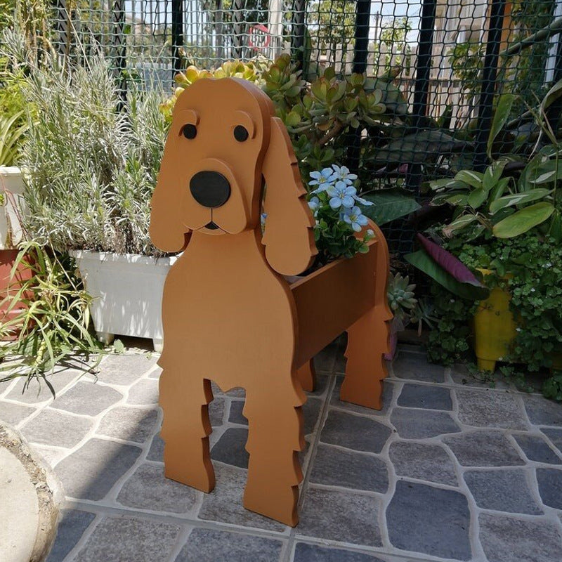 Wooden dog-shaped planter in a garden setting