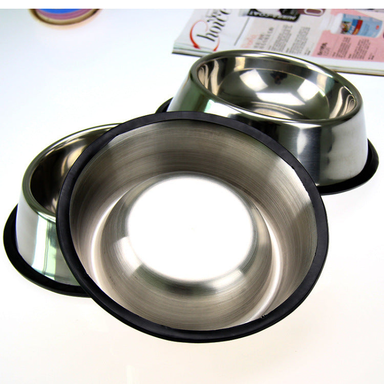Two stainless steel pet bowls with black rubber rims on a white background.