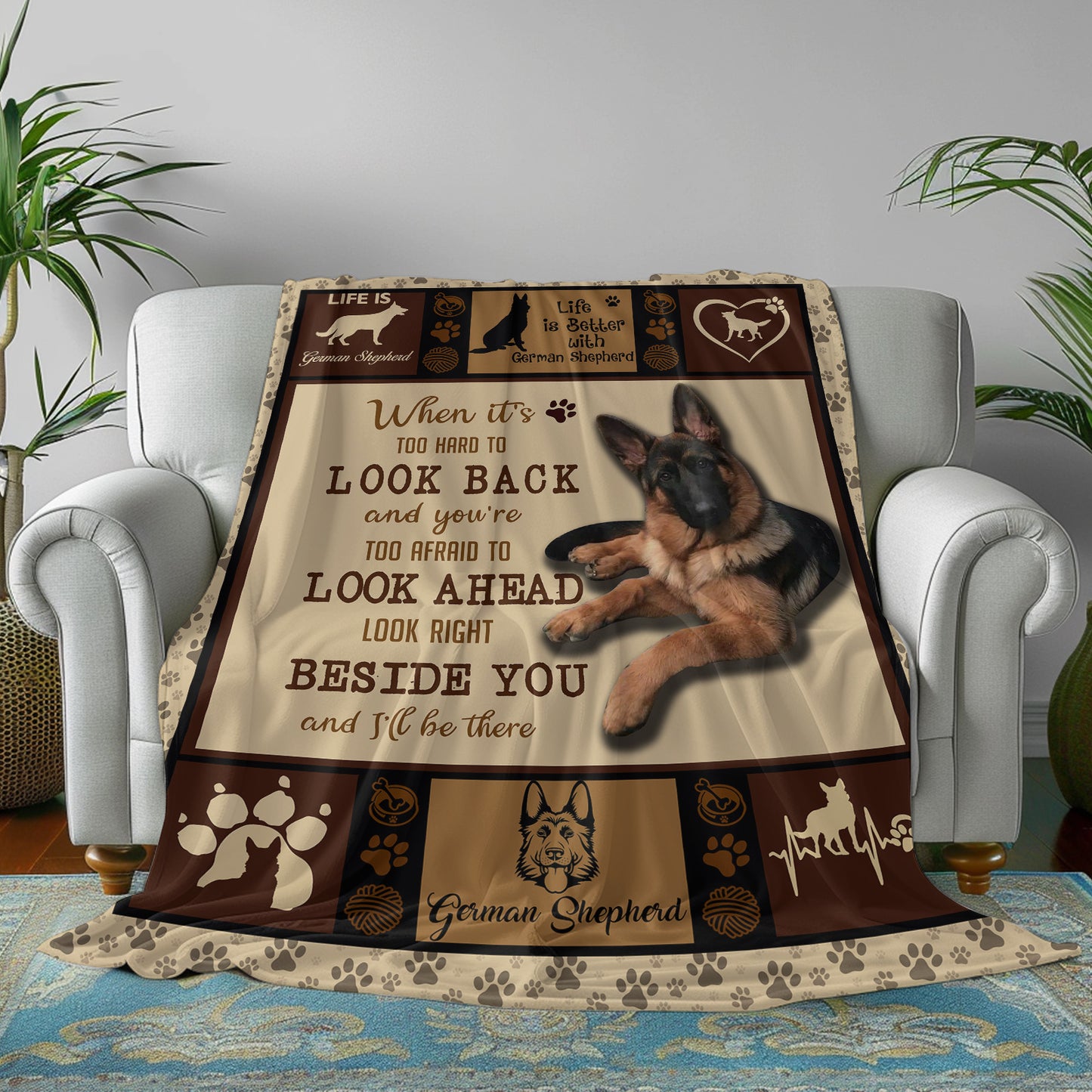 Decorative blanket with German Shepherd design and text on a couch