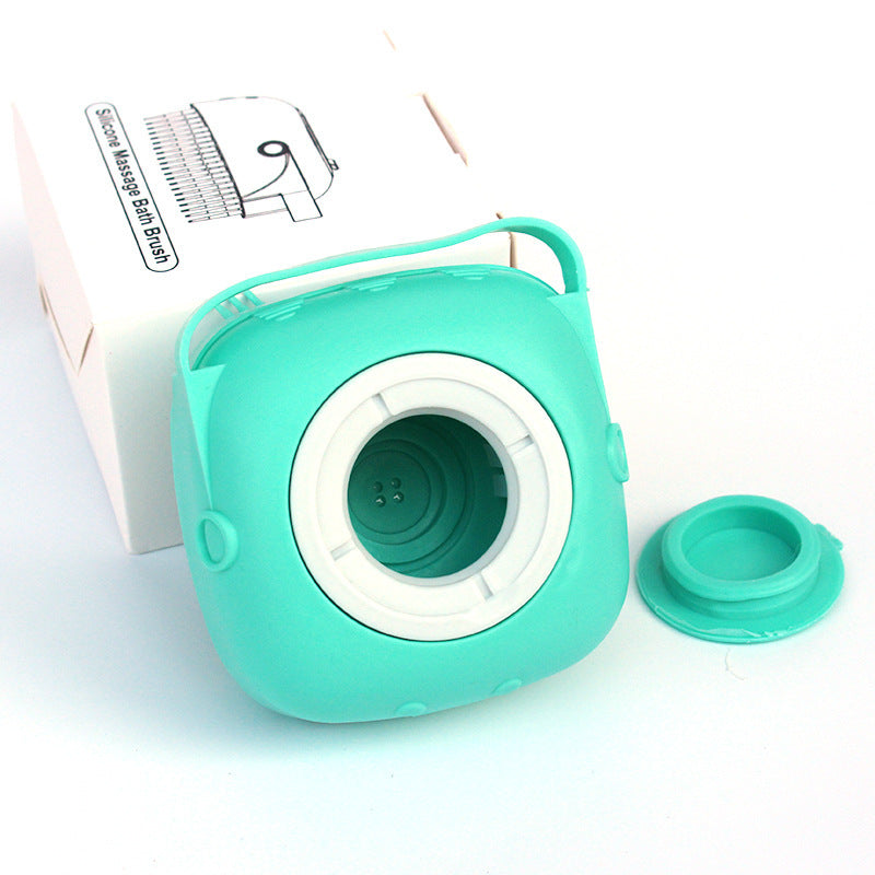 Teal silicone baby bottle brush with packaging on a white background