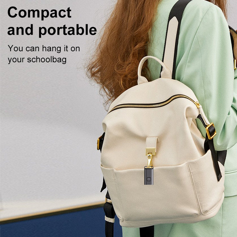 Person wearing a white backpack with text highlighting its compact and portable nature.