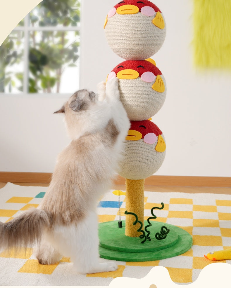 Cat playing with a colorful cat toy on a checkered floor.