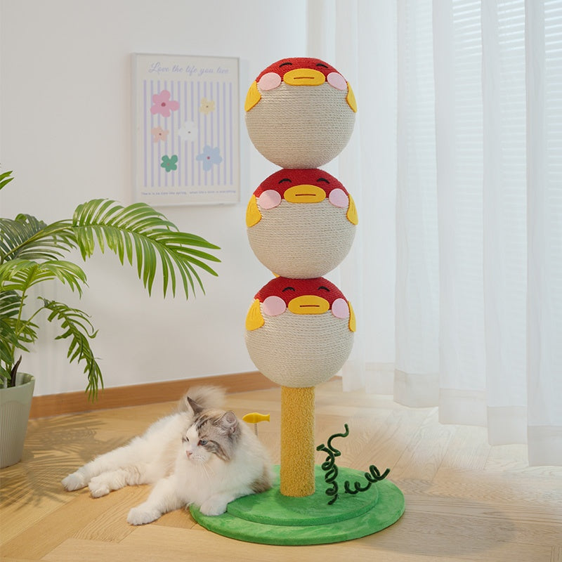 Cat playing with a colorful cat tree toy indoors.