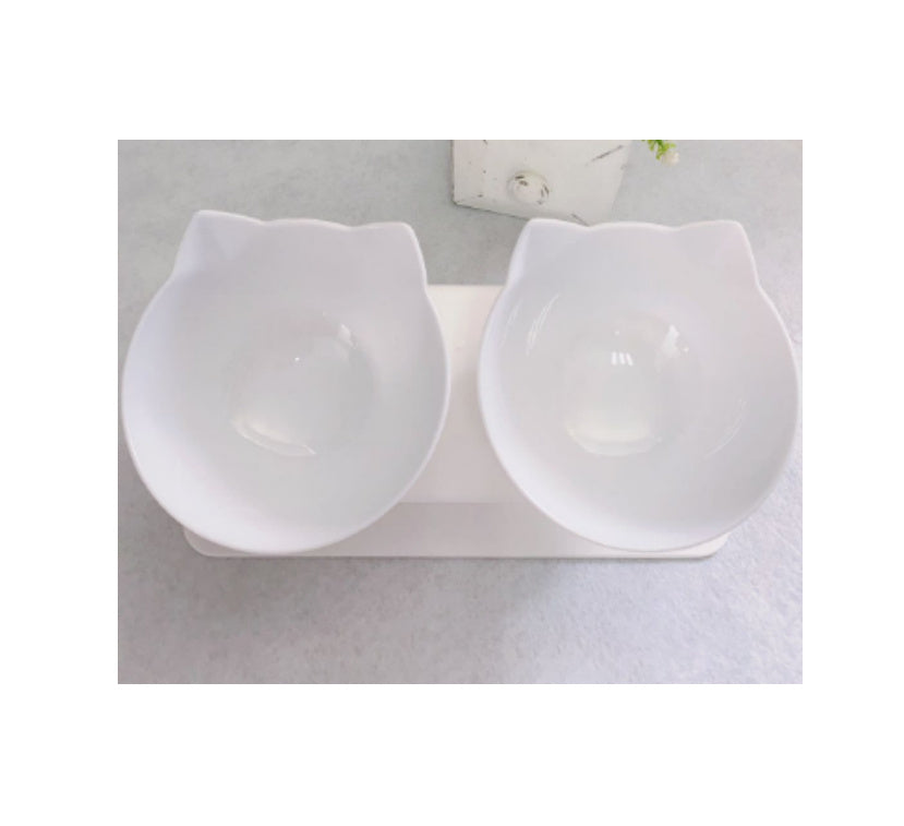 Two white ceramic bowls on a gray surface