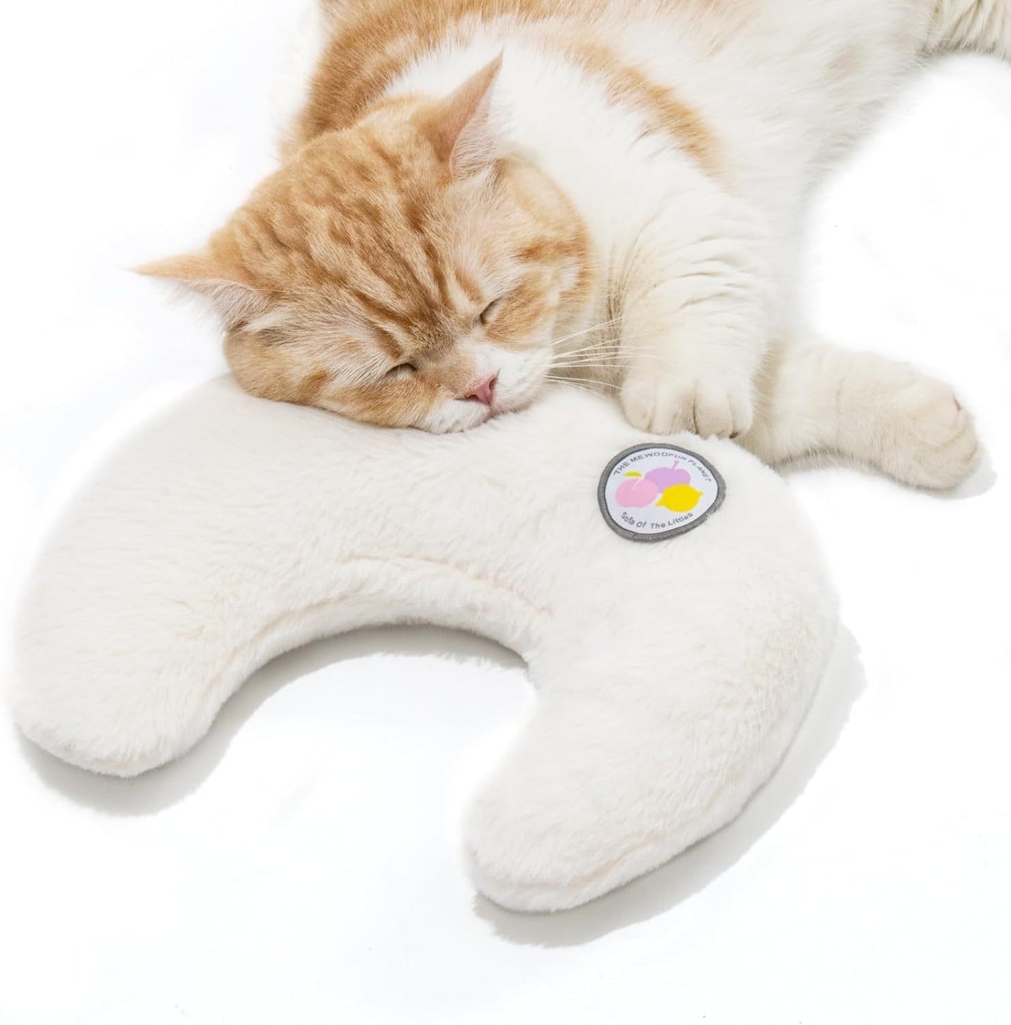 Cat lying on a U-shaped plush pillow with a visible brand logo on a white background