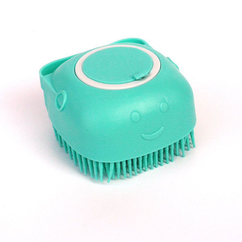 Turquoise grooming brush with a smiley face on a white background