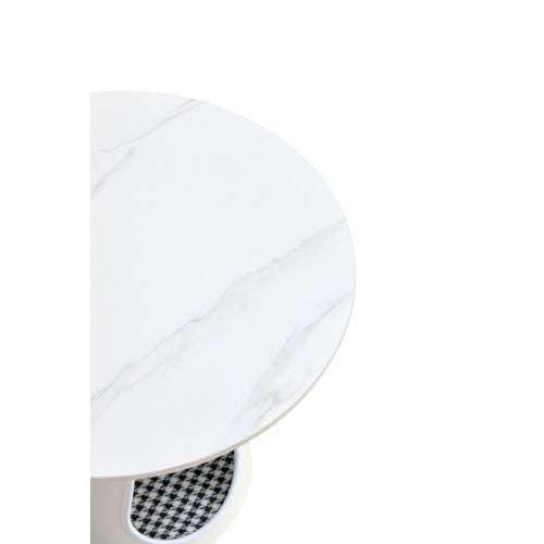 White plate with a black and white checkered pattern on a white background