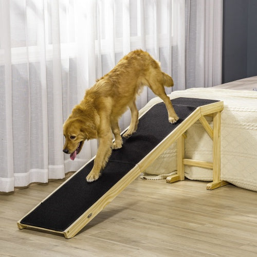 An elderly dog using a wooden ladder to get out of bed
