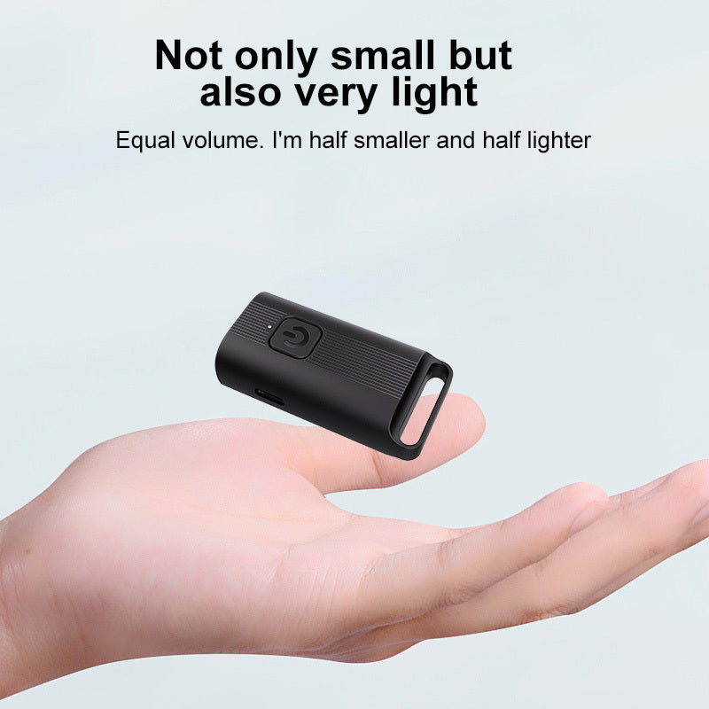 Small black anti-barking device held in a hand with text highlighting its size and weight.