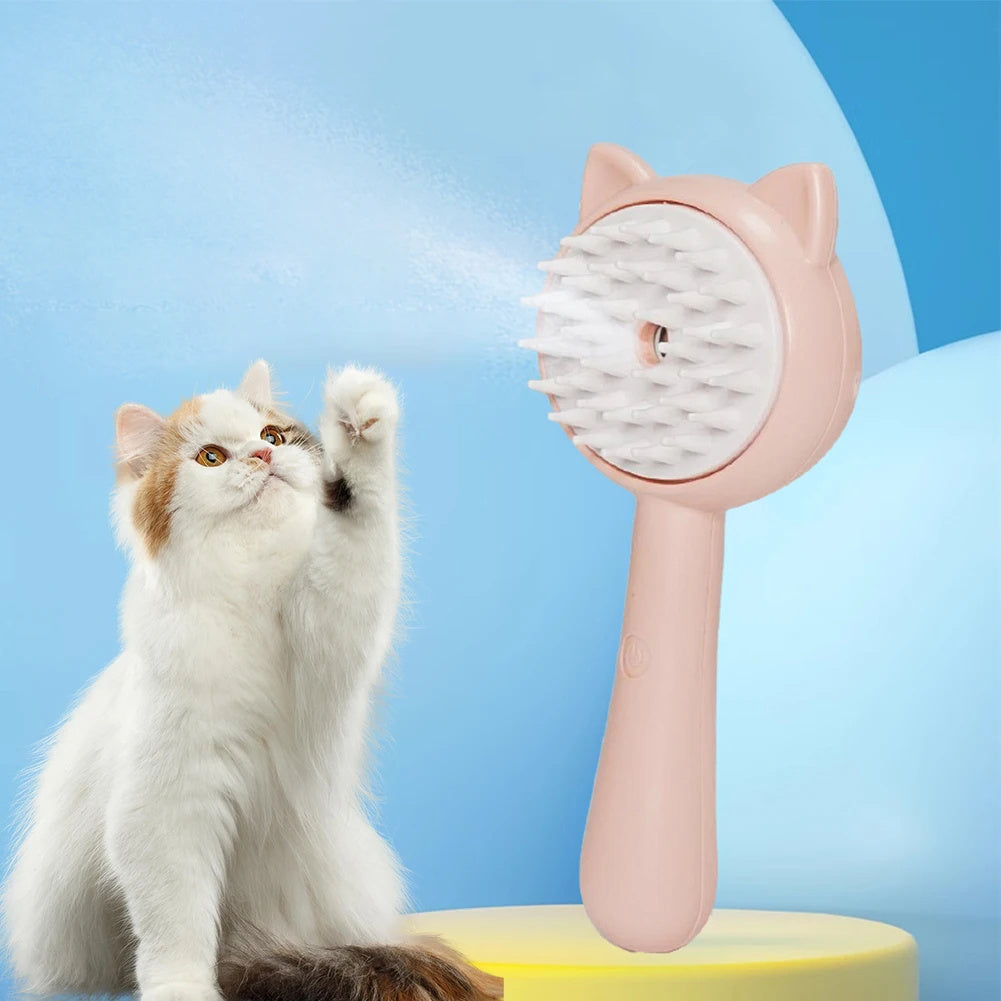 Cat playing with a pink cat-shaped grooming brush against a blue background