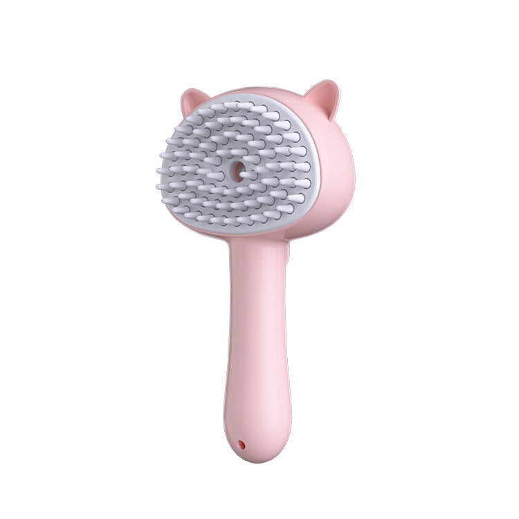 Pink pet grooming brush with a white background