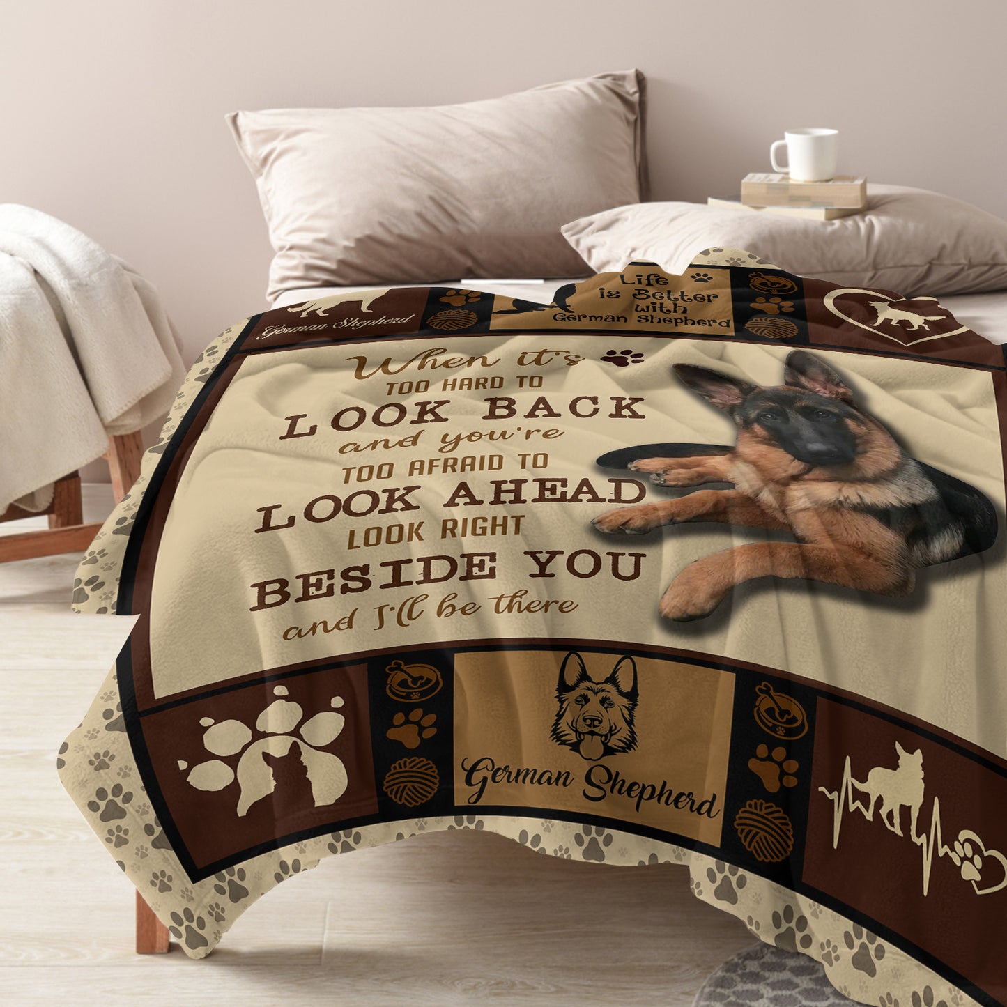 Decorative blanket with German Shepherd design and text on a bed