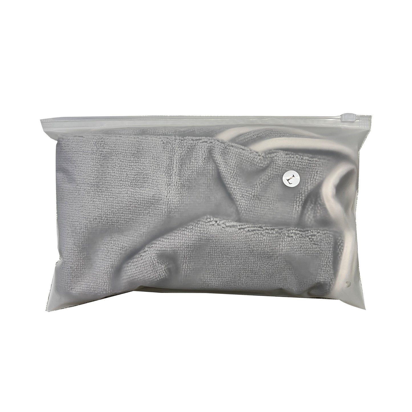 Gray textured dog bathrobe in a clear plastic bag on a white background