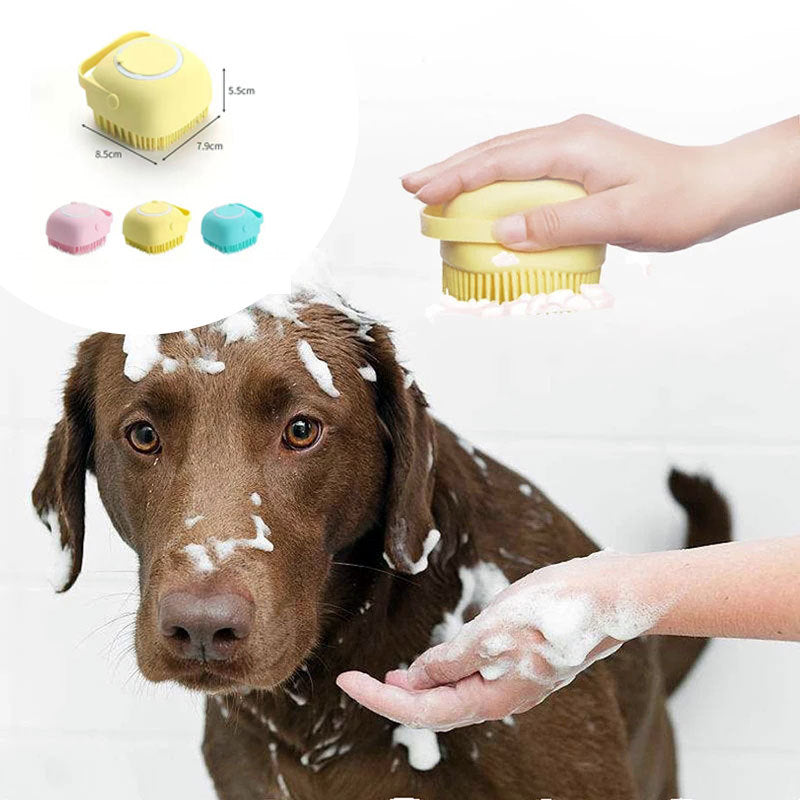 Dog being bathed with a yellow pet grooming brush, showing close-up of brush and product packaging.