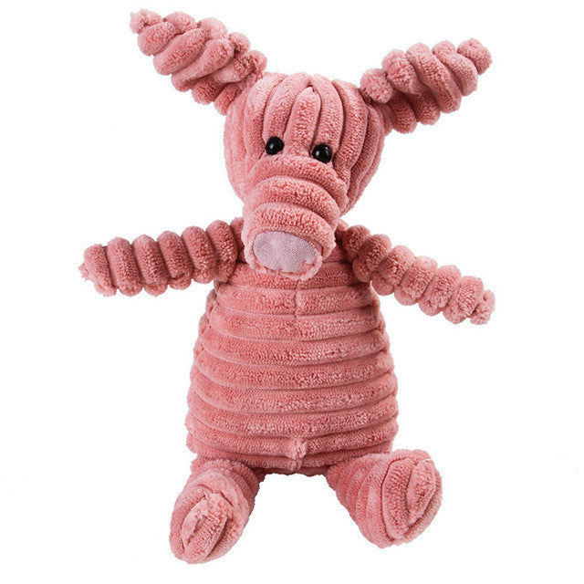 Pink plush toy with textured body and black eyes on a white background