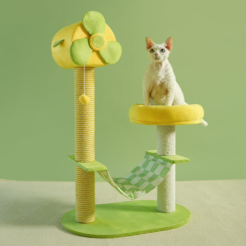 Cat tree with green and yellow design on a light green background