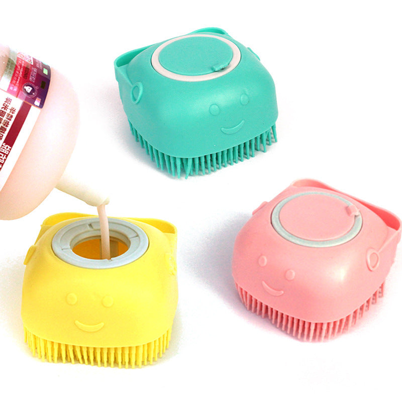 Three colorful silicone cups with smiley faces on a white background