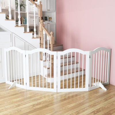 White pet gate in a home setting with pink walls and wooden floor.