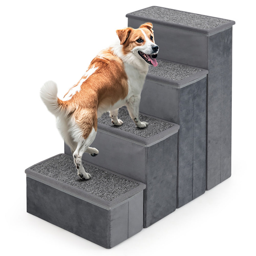 Dog using a set of gray pet stairs on a white background