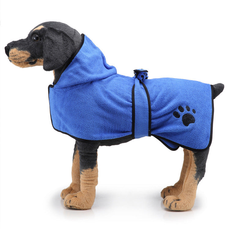 Dog wearing a blue bathrobe with a paw print on a white background