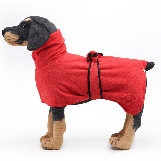 Dog wearing a red fleece bathrobe on a white background