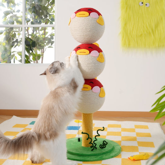 Cat playing with a colorful cat toy resembling a chicken on a checkered floor.
