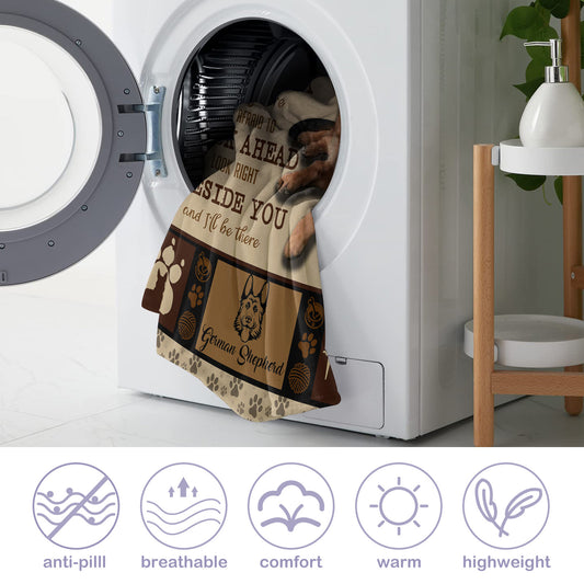 Dog blanket with text in front of a washing machine, with product features displayed below.