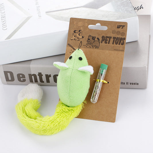 Green plush toy with a white base on a brown card labeled 'WT Pet Toys' against a white background.