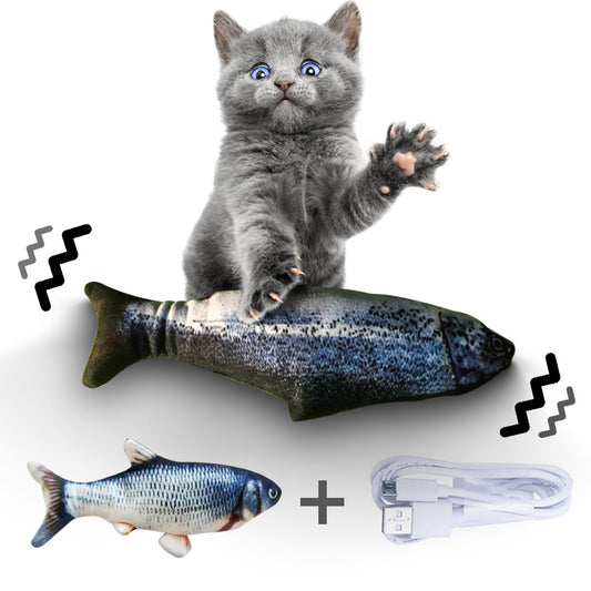 Cat playing with a fish-shaped toy with USB cable on a white background