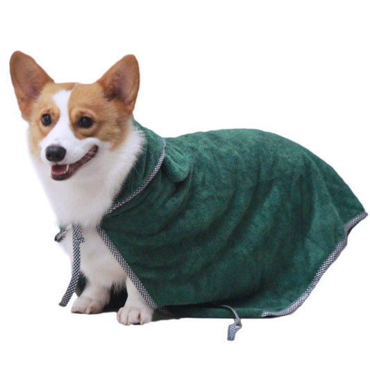 Dog wearing a green bathrobe on a white background