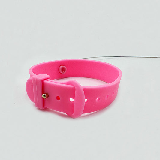 Pink dog collar on a light gray background