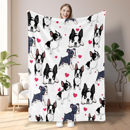 Person holding a blanket with dog pattern in a room with plants and furniture.