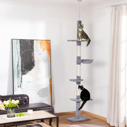 Cat tree with two cats on it in a living room setting