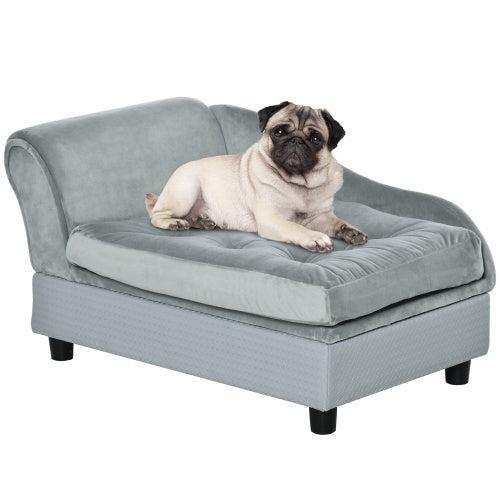 Pug lying on a gray pet bed with a white background