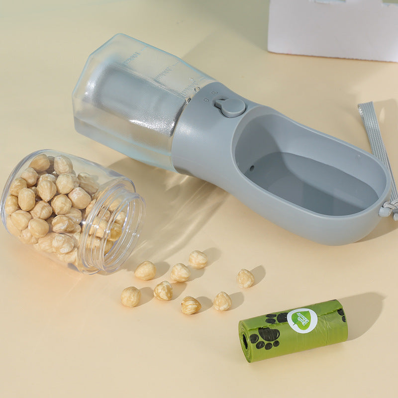 Pet food dispenser with a container of dog treats on a beige surface