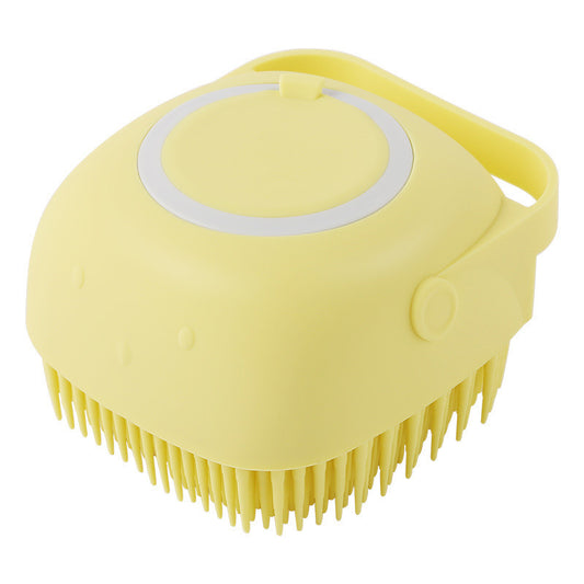 Yellow silicone scrubber with bristles on a white background