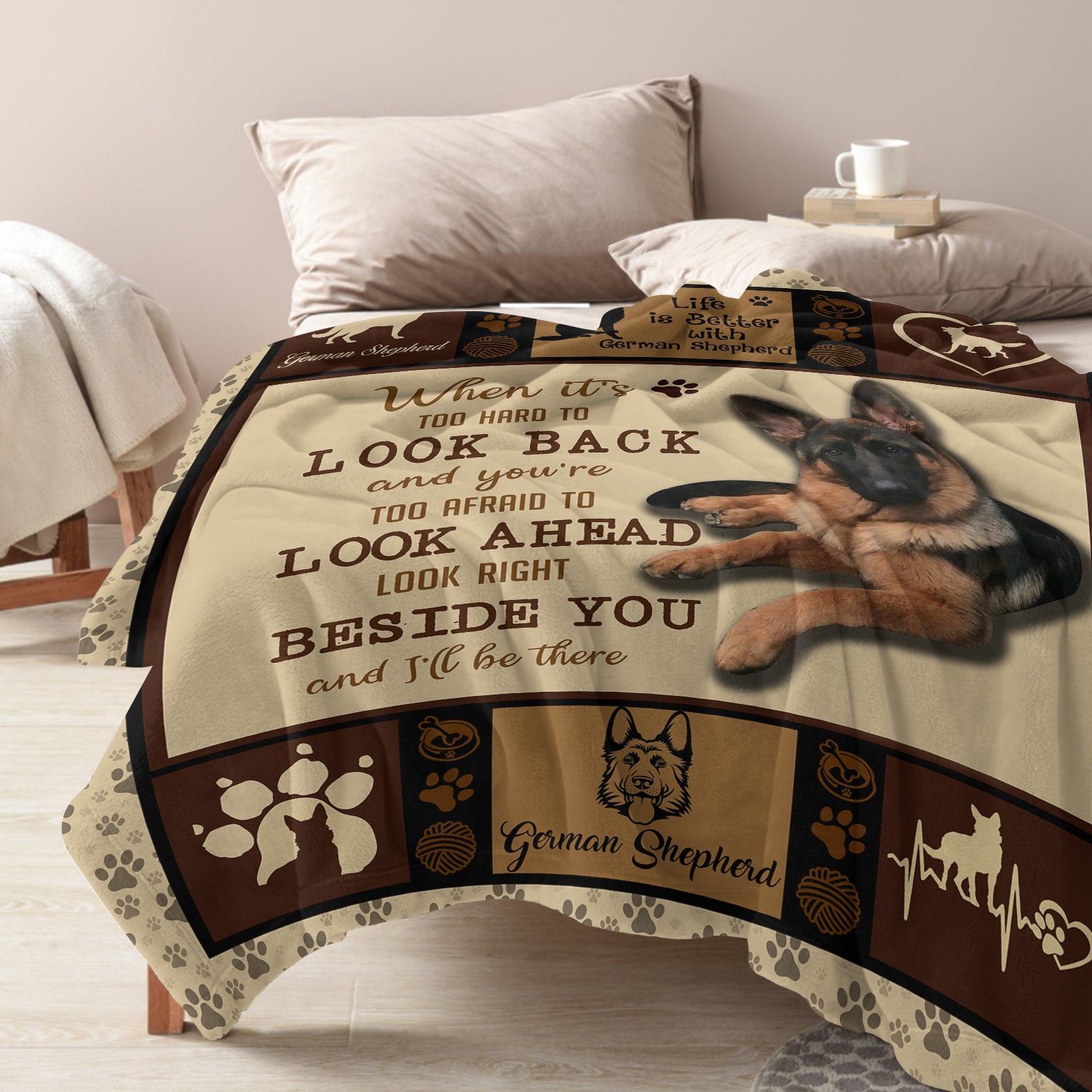 Decorative blanket with German Shepherd design and text on a bed
