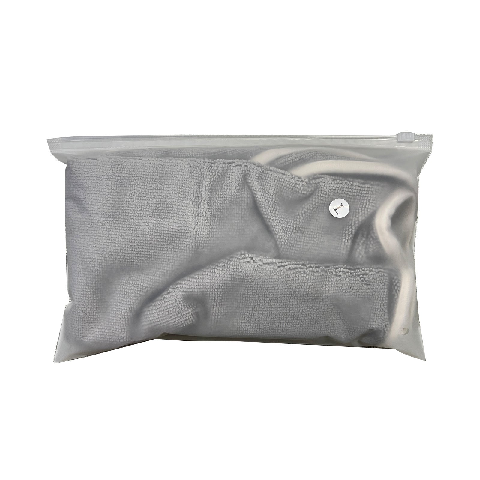 Gray textured dog bathrobe in a clear plastic bag on a white background
