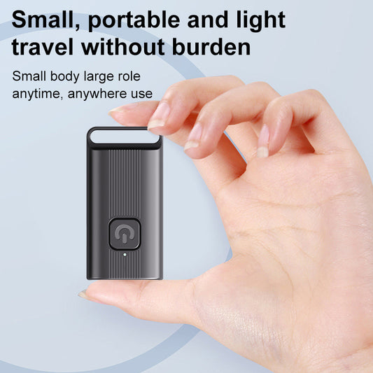 Small portable anti-barking device held in a hand with promotional text on a light blue background