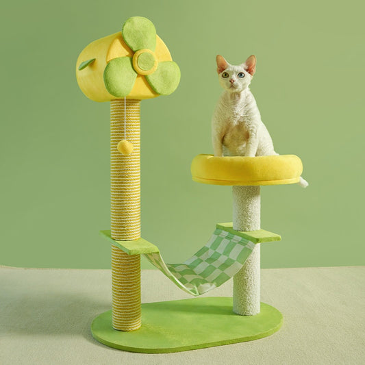Cat tree with green and yellow design on a light green background